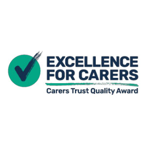 Excellence for Carers logo, featuring a check mark and text: Carers Trust Quality Award.